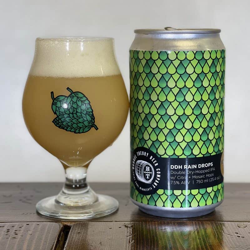 Glass of beer and crowler of Barrel Theory DDH Rain Drops with Vic Secret & Zamba.