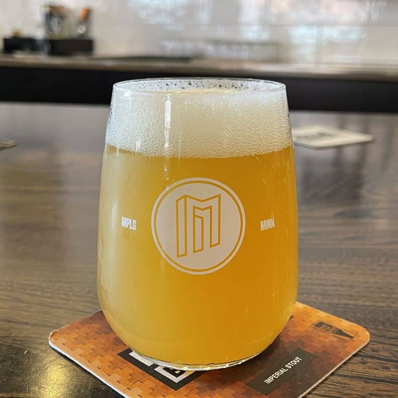 Glass of Double Local Dream Mirror DDH DIPA on the bar at Modist Brewing.