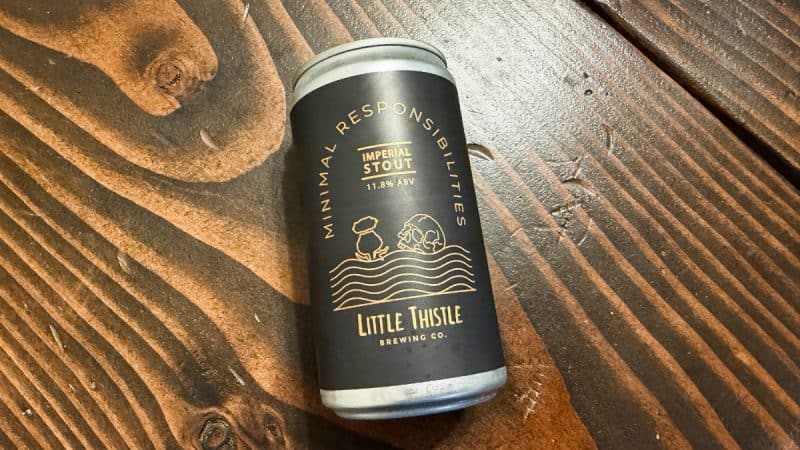 Can of Little Thistle Brewing Minimal Responsibilities on a wooden table.